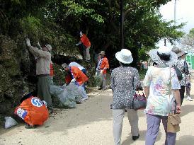 Naha citizens clean street along Shuri Castle Park